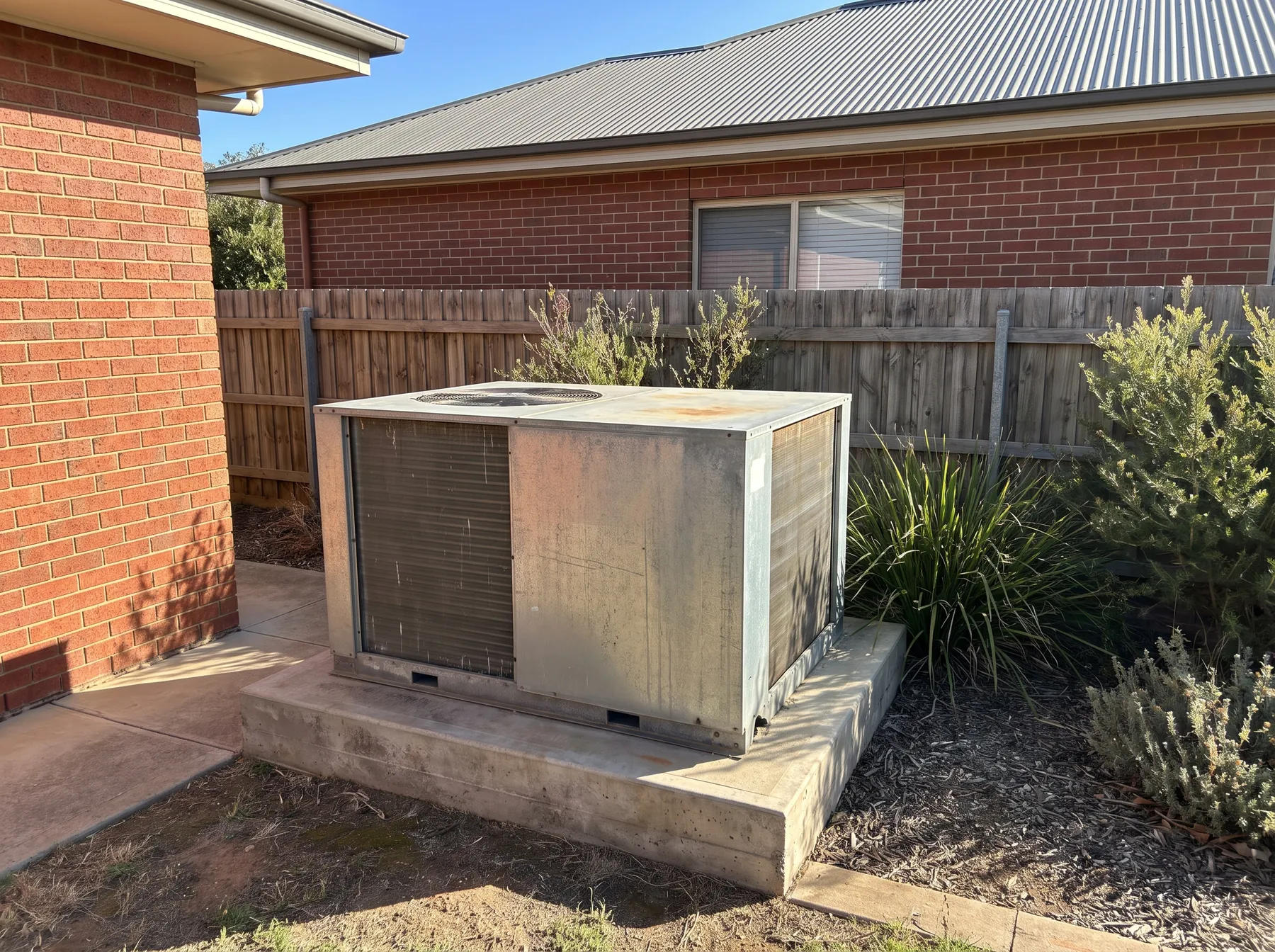 Ducted outdoor condenser at a suburban home